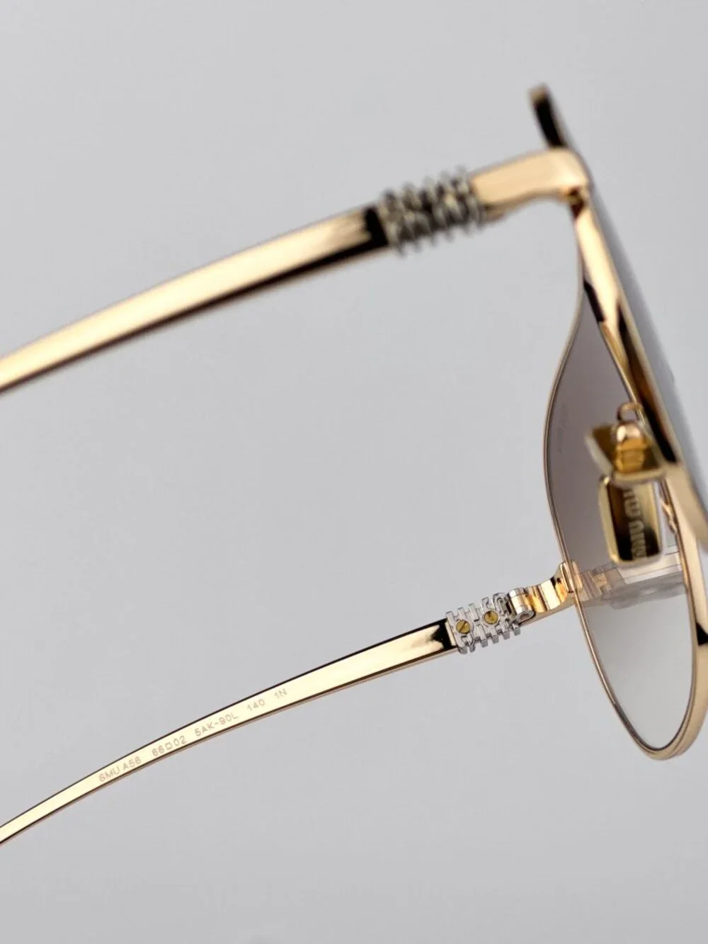 Miu Miu MUA56S 5AK90L Sunglasses – Shiny Gold Pilot Metal Frame Brown Gradient